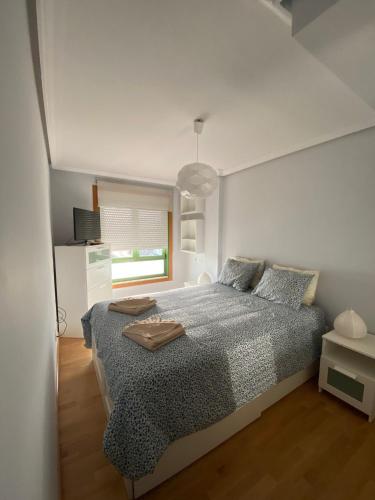 Posteľ alebo postele v izbe v ubytovaní Apartamento Chinijo