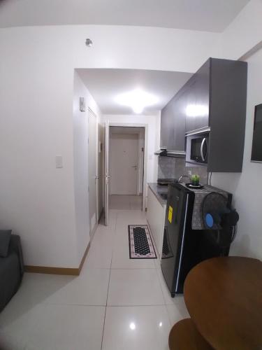 Kuchyň nebo kuchyňský kout v ubytování SM South Residences, 1 bedroom with balcony.