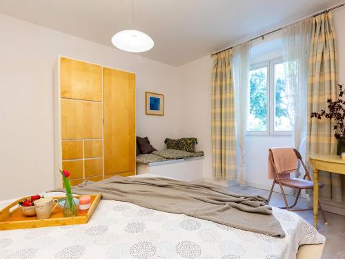 a bedroom with a bed and a window at Apartment Anika Old Town in Poreč