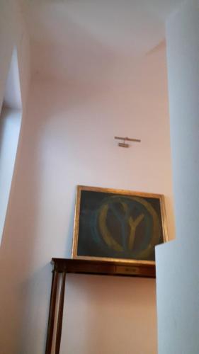 a painting on a wall with a plane on the ceiling at Park House in Mondello