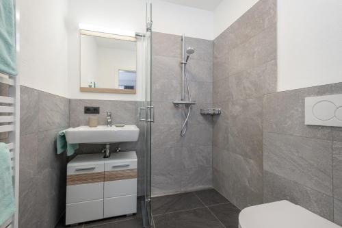 a bathroom with a shower and a sink at My Dahoam in Eben im Pongau