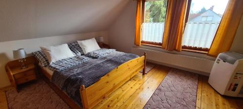 Postel nebo postele na pokoji v ubytování Patkóház