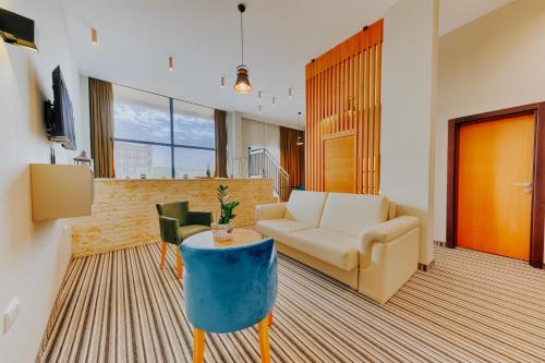 a living room with a couch and a table at AM Palace in Ulcinj