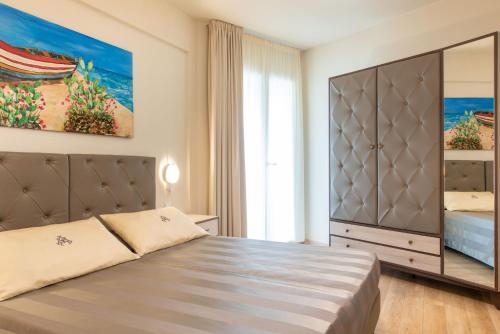 En eller flere senge i et værelse på Hotel Atlantico