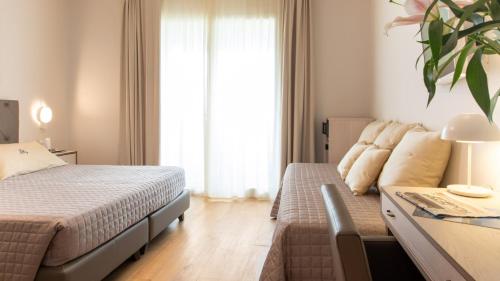 Ένα ή περισσότερα κρεβάτια σε δωμάτιο στο Hotel Atlantico