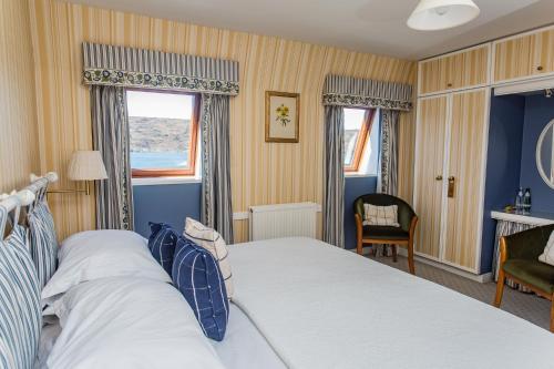 a hotel room with a bed and a window at Tigh an Eilean Hotel in Shieldaig