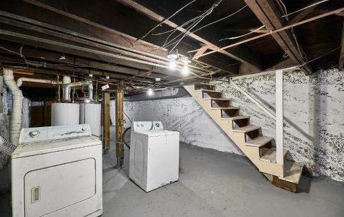 an empty room with a staircase in a building at 1 Bd Apt near forest park, Science Center & dining in Tower Grove