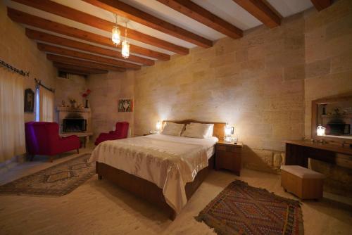 Кровать или кровати в номере Salkım Cave House
