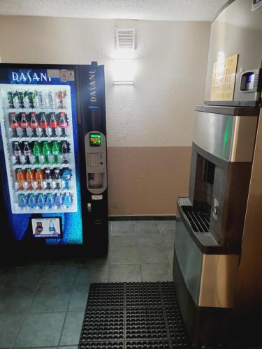 a vending machine in a store with a drink cooler at Ramada by Wyndham Grand Junction in Grand Junction