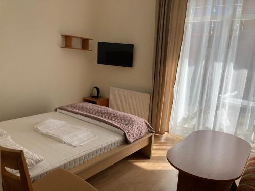 Postel nebo postele na pokoji v ubytování Rybitwa Karwia