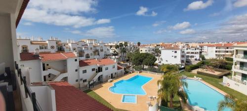 a view of the pool from the balcony of a apartment at Albufeira Oura Beach Apartment in Albufeira