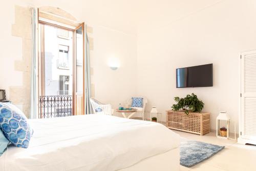 Posteľ alebo postele v izbe v ubytovaní Sicily Sunset Suite