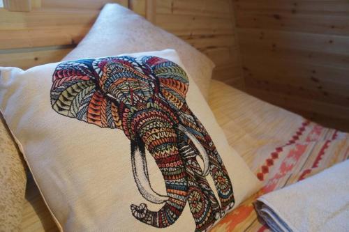 a picture of an elephant on a pillow at Riverside Retreat in Taunton