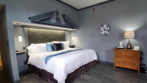 a bedroom with a large bed and a window at Blackberry Inn in Camden