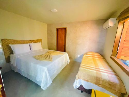 Cama o camas de una habitación en Pousada Jaboticaba Caraíva