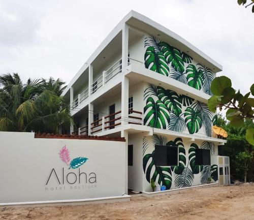 a building with a mural on the side of it at Casa aloha-Isla Holbox in Holbox Island