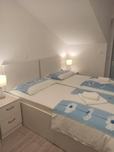 Postel nebo postele na pokoji v ubytování Peric Apartment West Dubrovnik