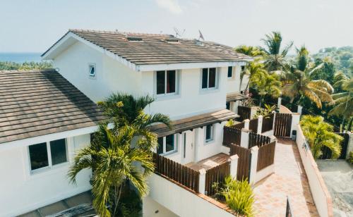 an aerial view of a house with palm trees at Piece of Paradise in Las Terrenas