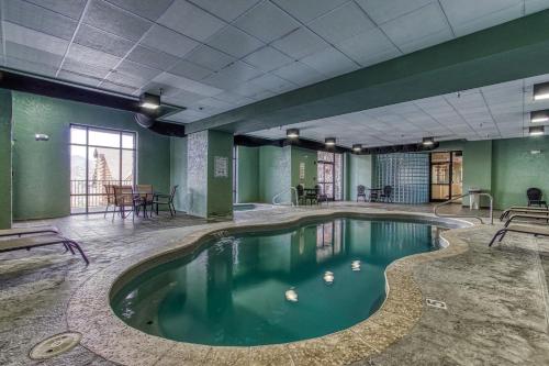 a swimming pool with ducks in the water at Gorgeous 2BD 2BTH Condo with Mountain Views Pool Hot Tub Game Room Close to Parkway in Pigeon Forge