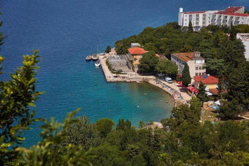 a small island in the middle of a body of water at ELA i GABI in Omišalj