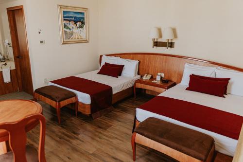 Säng eller sängar i ett rum på Gran Hotel Diligencias