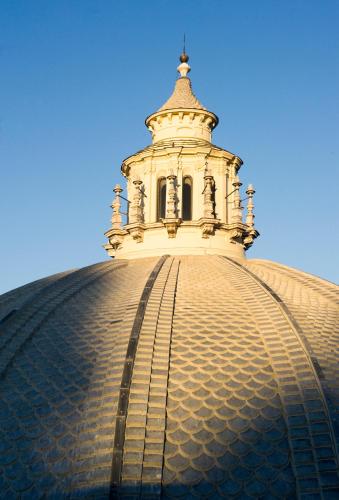 a building with a tower on top of it at Rocco Forte Hotel De Russie in Rome