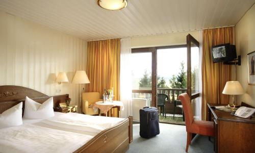 Кровать или кровати в номере Wellnesshotel Zum Koch
