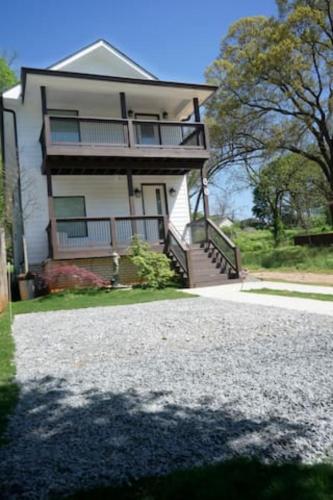 a large house with a porch and a driveway at Atlanta Unit 1 Room 1 - Peaceful Private Master Bedroom with Private Balcony in Atlanta