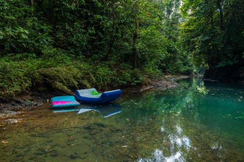 two rafts sitting in the middle of a river at Drake Bay River View in Drake