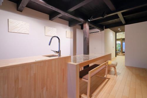 a kitchen with a sink and a counter top at Kyo no oozora FUKA in Kyoto