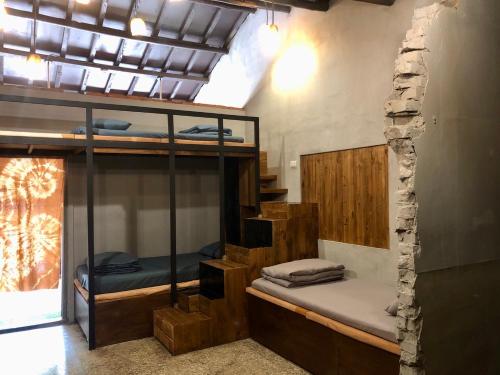 a room with several bunk beds in a building at 破豆基地 in Kaohsiung