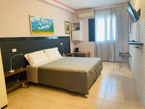 Кровать или кровати в номере Amici