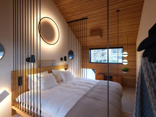 Een bed of bedden in een kamer bij vondice hotel