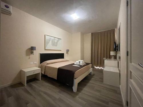 Katil atau katil-katil dalam bilik di Faro Bianco Gallipoli - Suites & Apartments