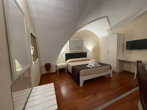Katil atau katil-katil dalam bilik di Faro Bianco Gallipoli - Suites & Apartments