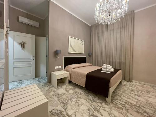 Katil atau katil-katil dalam bilik di Faro Bianco Gallipoli - Suites & Apartments