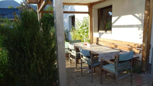 a table and chairs sitting on a patio at Ferienwohnung Karin Humer in Bad Ischl