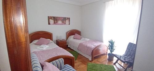 Postel nebo postele na pokoji v ubytování Itzurun, Zumaia, te encantara!