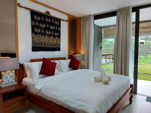 Postel nebo postele na pokoji v ubytování Serenity Private Villa Mas Ubud