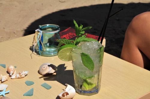 a drink sitting on top of a table at Dedalos Beach Hotel in Sfakaki