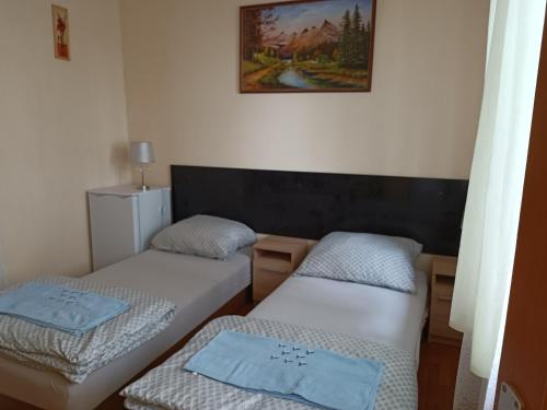 Кровать или кровати в номере Akhilleus vendégház