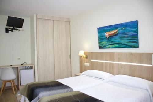 Katil atau katil-katil dalam bilik di Hotel Playa de Lago