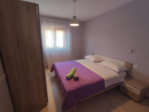 Tempat tidur dalam kamar di Apartment Paić