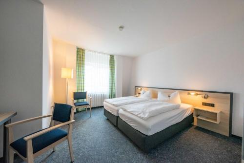 Postel nebo postele na pokoji v ubytování Hotel 7 Säulen GmbH
