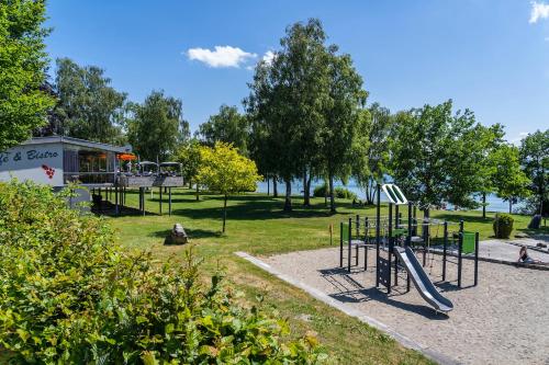 a park with a playground with a slide at Campingplatz Alpenblick in Hagnau