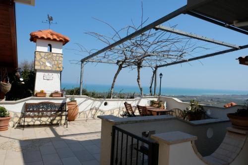 a building with a lighthouse on a patio at B&B VILLA IOLANDA un soggiorno in Relax vista Mare e Montagna in Fossacesia