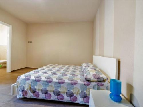 เตียงในห้องที่ Appartamenti Area123