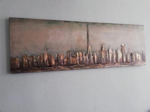 a painting of a city skyline on a wall at Schlafladen in Melsungen