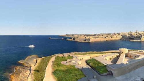an aerial view of a large body of water at Superb Seafront Family Apartment in Sliema