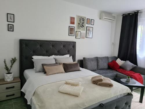 Postel nebo postele na pokoji v ubytování Apartman Rosemary